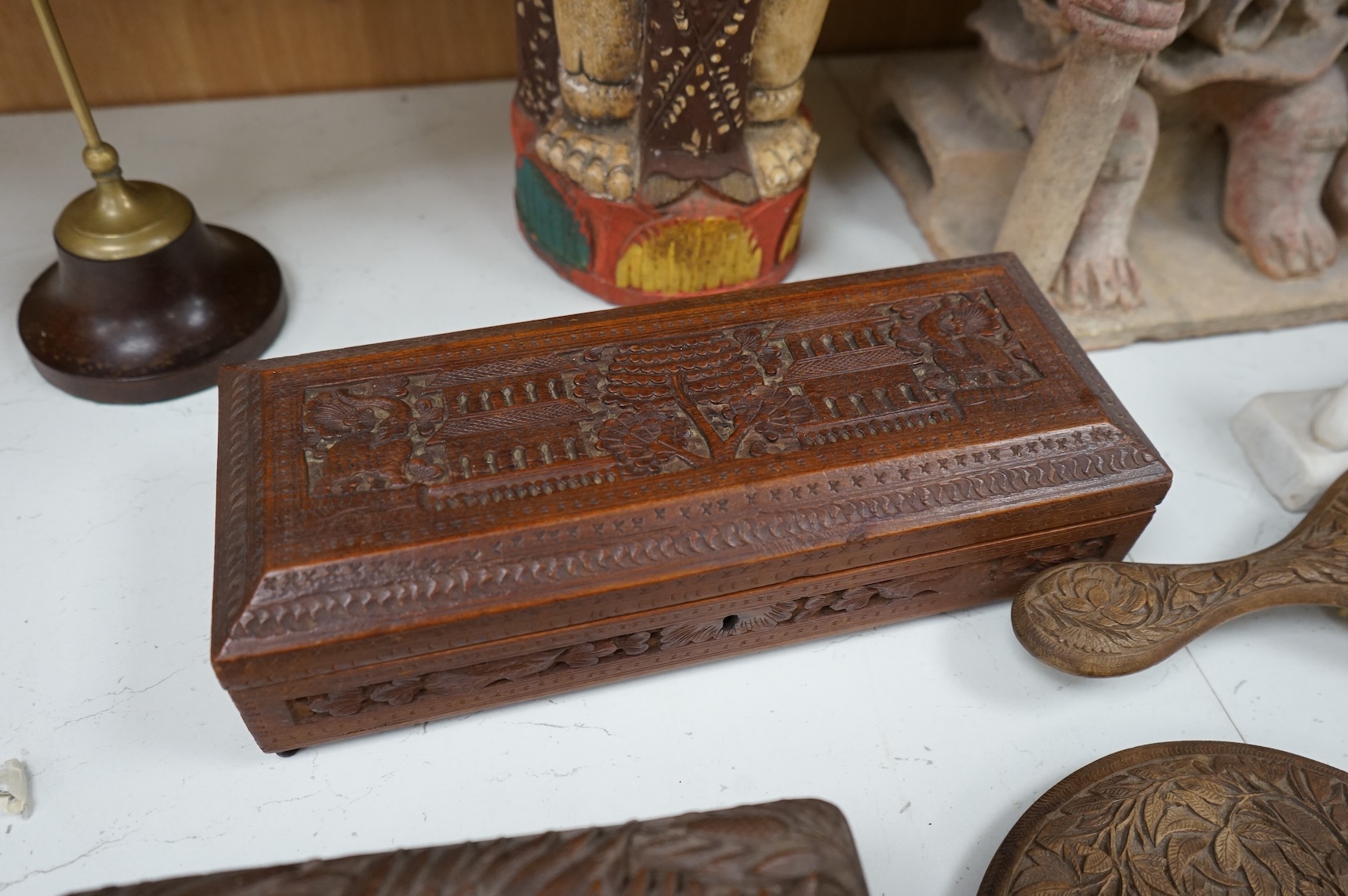 Eight south-east Asian carvings and a mounted bone, tallest 43cm